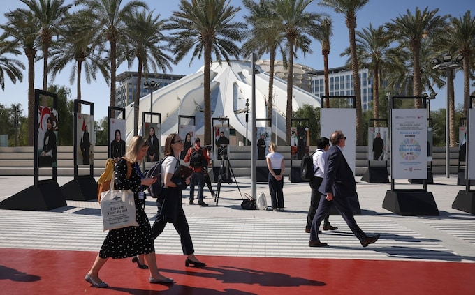 Attendees walk through the Green Zone on day two of the COP28 climate co<em></em>nference at Expo City in Dubai