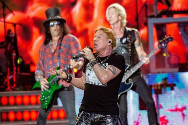 Axl Rose, center, Slash, back left and Duff McKagan, back right of Guns N' Roses perform during the Glasto<em></em>nbury Festival in Worthy Farm, Somerset, England, Saturday, June 24, 2023. (Joel C Ryan/Invision/AP)