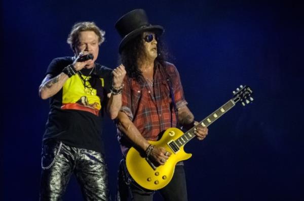 GLASTONBURY, ENGLAND - JUNE 24: Axl Rose (L) and Slash of Guns 'n' Roses perform on the Pyramid Stage on Day 4 of Glasto<em></em>nbury Festival 2023 on June 24, 2023 in Glastonbury, England. The Glasto<em></em>nbury Festival of Performing Arts sees musicians, performers and artists come together for three days of live entertainment. (Photo by Leon Neal/Getty Images)