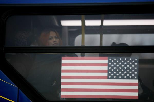 Migrants leave a shelter in Floyd Bennett Field in Brooklyn