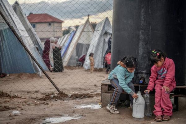 Displaced Palestinian families are packed into a tent city on Tuesday in Rafah, Gaza, wher<em></em>e they took shelter from Israeli attacks.