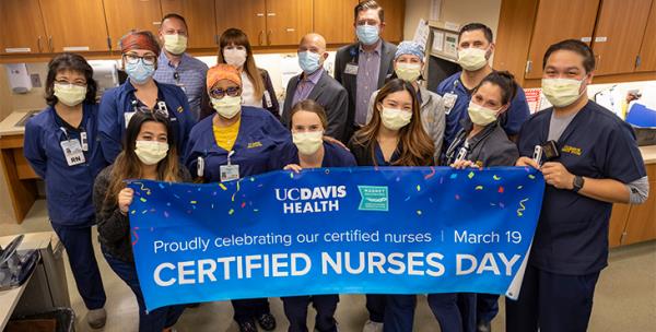 Certified Nurses celebration with banner