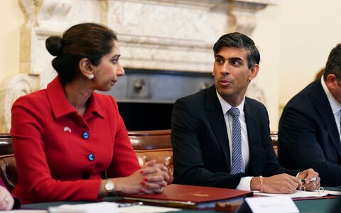 Britain's Home Secretary Suella Braverman listens to Britain's Prime Minister Rishi Sunak as he hosts a policing roundtable at 10 Downing Street, London