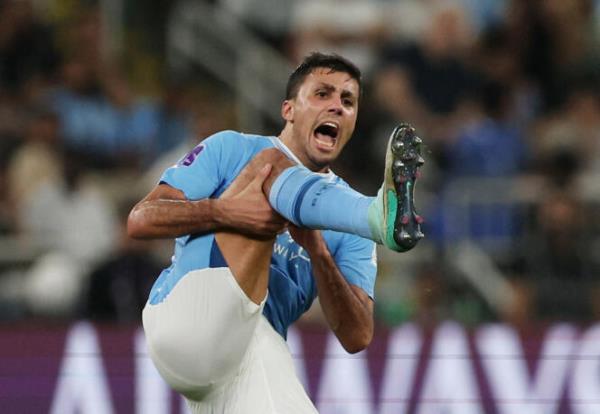 Manchester City's Rodri reacts after sustaining an injury during the FIFA Club World Cup final football match between Brazil's Fluminense and England's Manchester City at the King Abdullah Sports City in Jeddah on December 22, 2023. 